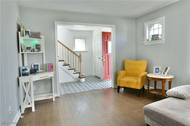 Living area featuring hardwood / wood-style floors, stairs, and baseboards | Image 21