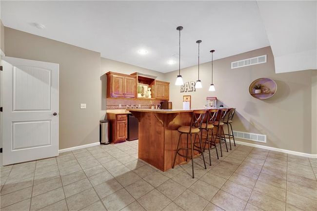 Tile flooring in the bar area. | Image 40