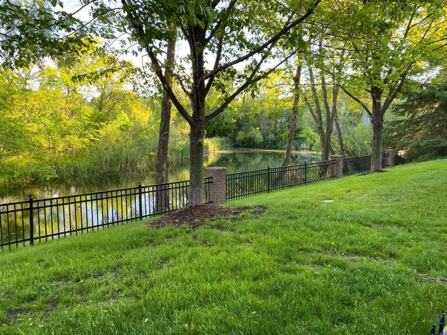Like a private park? This home features a spacious backyard overlooking a pond and tons of wildlife. | Image 29