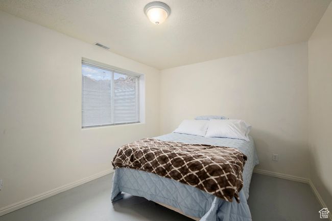 Bedroom featuring baseboards and visible vents | Image 37