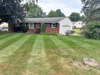 Ranch-style house with a front yard | Image 1