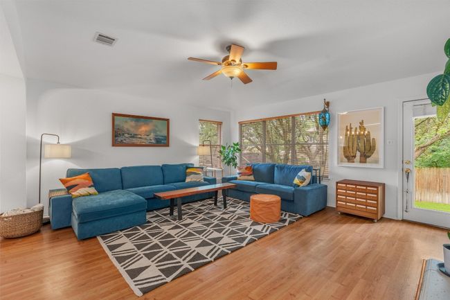 Living room featuring ceiling fan and wood finished floors | Image 15