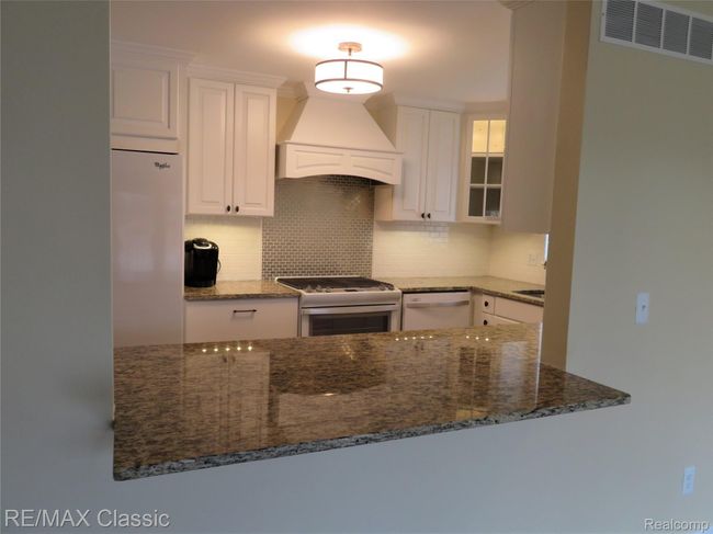 A view looking into the kitchen from the great room. | Image 9