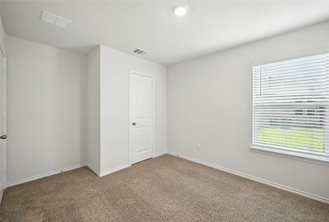 Spare room featuring carpet flooring and baseboards | Image 14