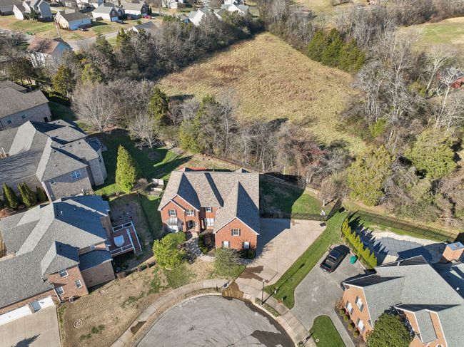 This home backs to acreage with a private residential home on it. | Image 49