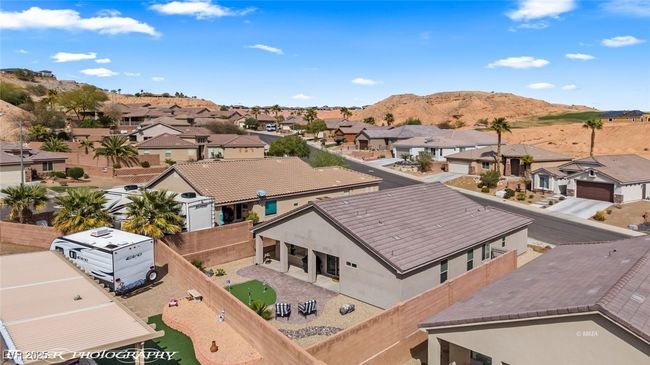 Aerial view of residential area featuring a mountain backdrop | Image 65