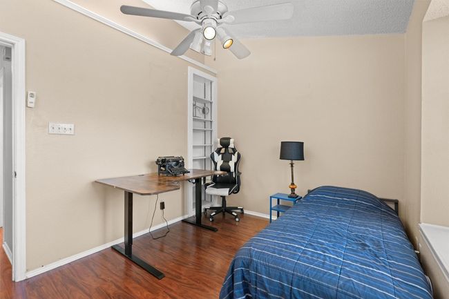 Bedroom featuring wood finished floors and a ceiling fan | Image 13