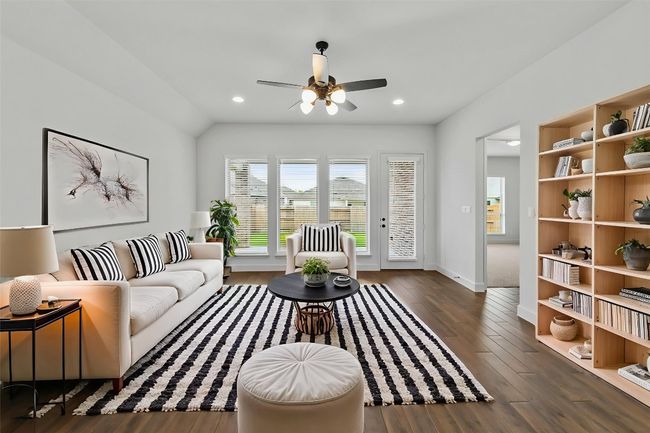 Living area featuring wood finished floors, a ceiling fan, and recessed lighting | Image 10