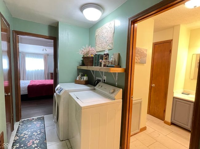 laundry area featuring separate washer and dryer | Image 6