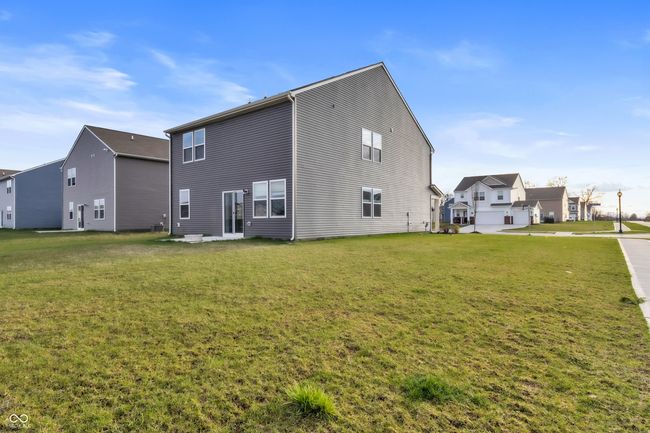 rear view of property with a residential view and a lawn | Image 33
