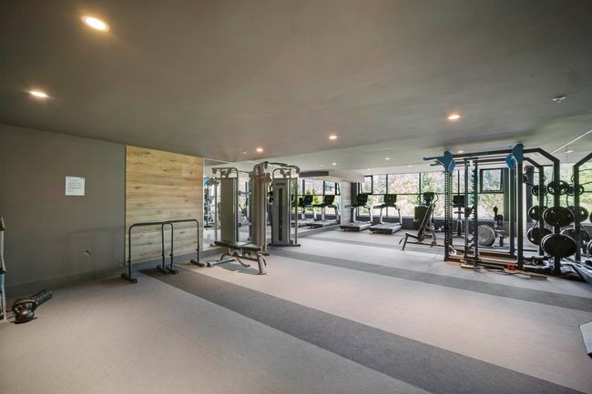 Gym with recessed lighting and a wall of windows | Image 19