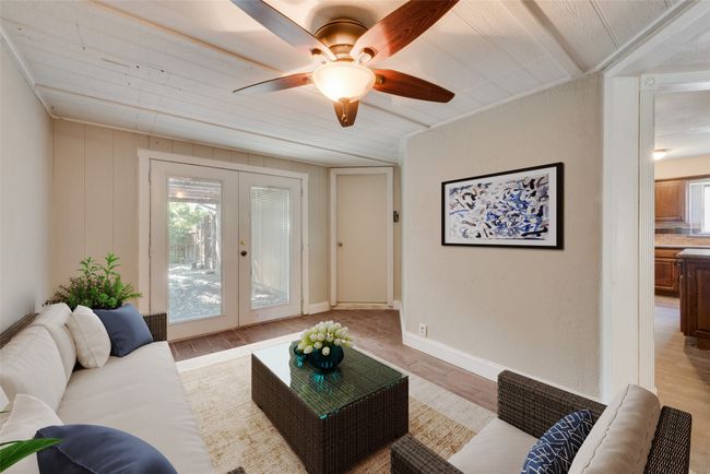 Living area featuring french doors, plenty of natural light, light wood-type flooring, and ceiling fan | Image 12