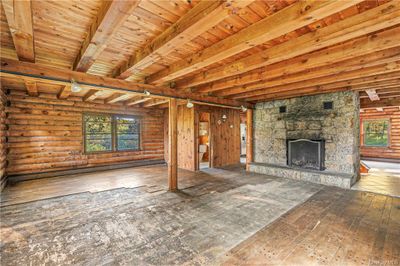 Cabin with a deck and a front lawn | Image 2