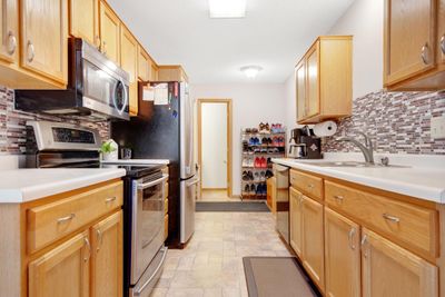 Kitchen features stainless appliances along with plenty of counter and cabinet space! | Image 3