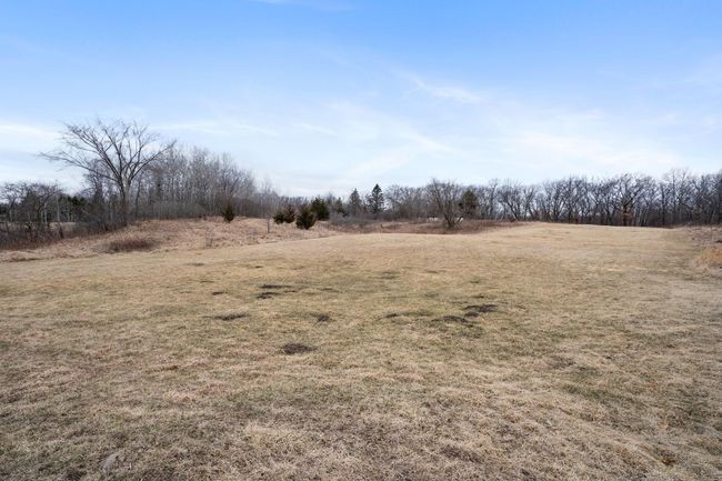 Acroos the field to the back woods. Property goes into the woods a little ways. | Image 59