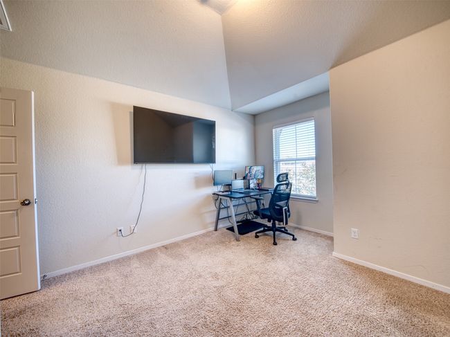 Office space featuring vaulted ceiling and carpet | Image 19
