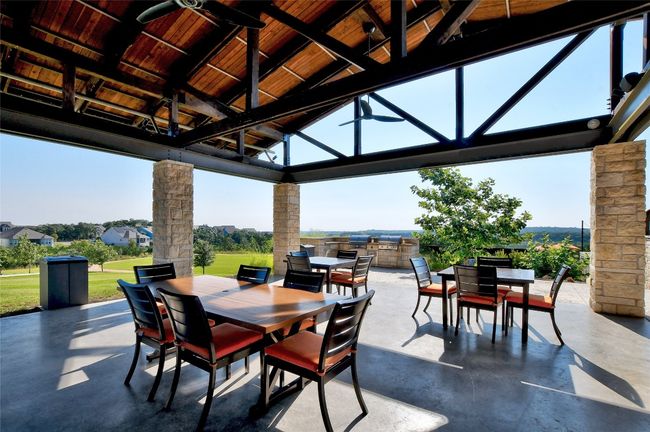 View of patio with outdoor dining area, a gazebo, and ceiling fan | Image 36