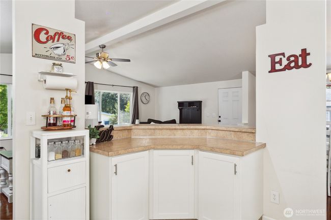 Looking at the front door/living room from the kitchen | Image 11