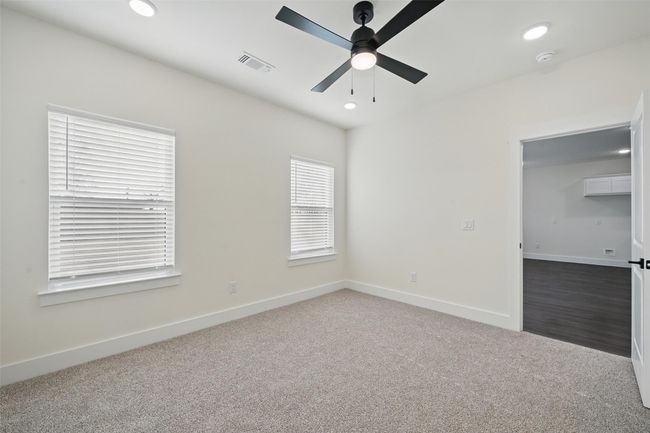 Carpeted spare room with baseboards, ceiling fan, visible vents, and recessed lighting | Image 20