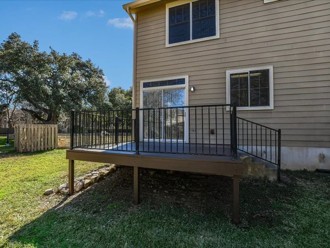 Back of property featuring a yard and a wooden deck | Image 25