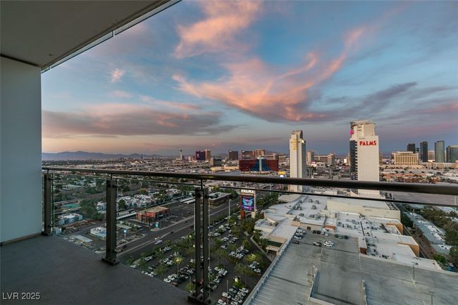 Balcony at dusk featuring a view of city | Image 35