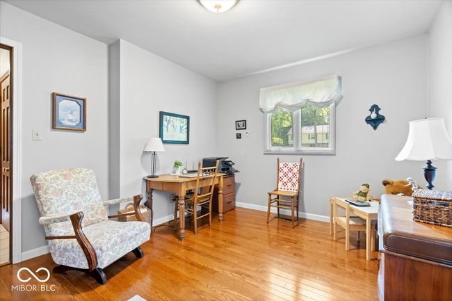 office area featuring light wood finished floors and baseboards | Image 16