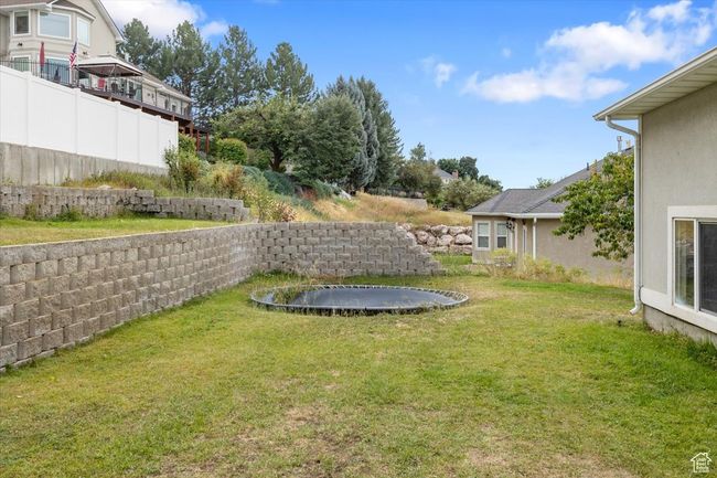 View of yard featuring a trampoline | Image 40