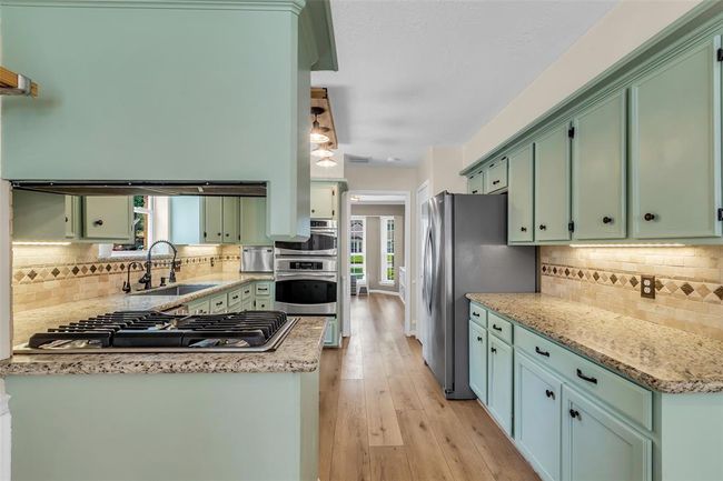 View from the kitchen into the dining room. | Image 19