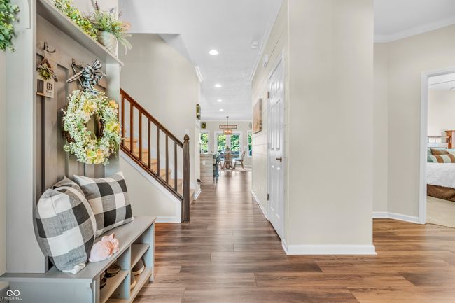 entryway featuring recessed lighting, stairway, vinyl plank flooring, and ornamental molding | Image 5
