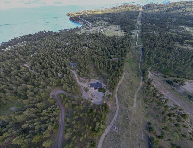 Bird's eye view with a wooded view and a water view | Image 53