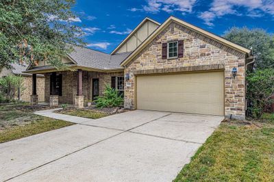 Two car attached garage and long driveway to accommodate your vehicles and still have room for guests. | Image 3