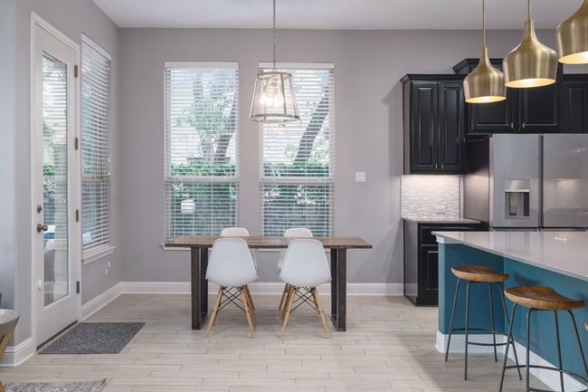 Dining space with light wood finished floors and baseboards | Image 8