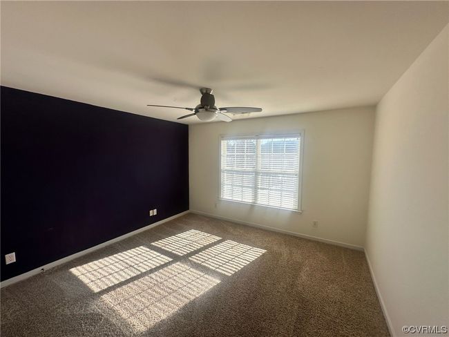 Carpeted spare room with ceiling fan | Image 9