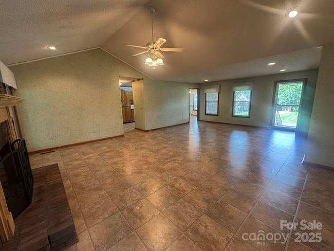 view from firplace to living area | Image 12