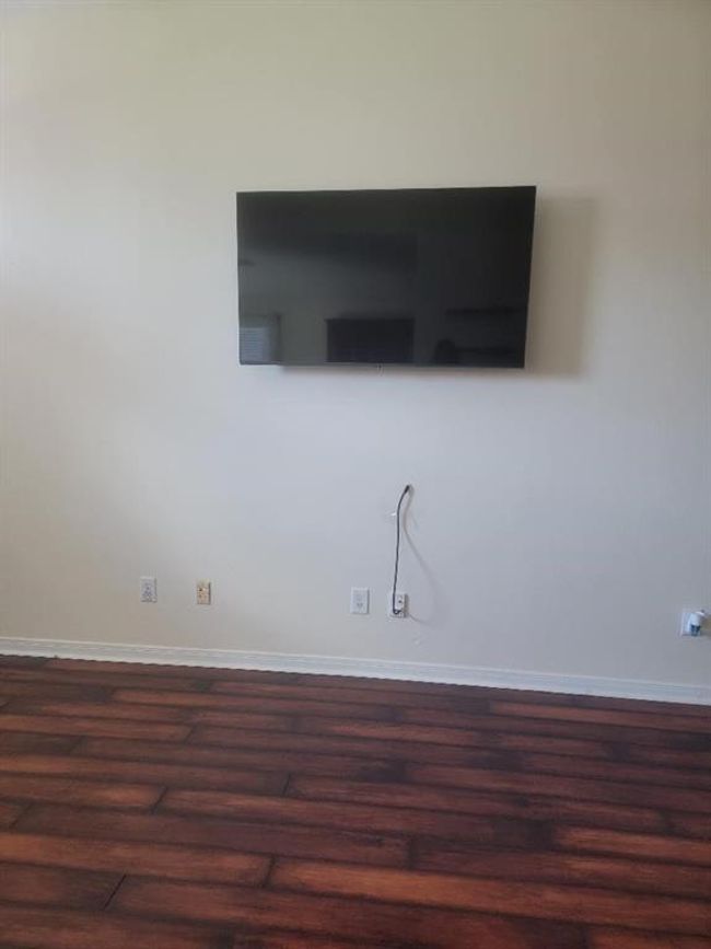 TV on the wall stays in the Family room. | Image 9