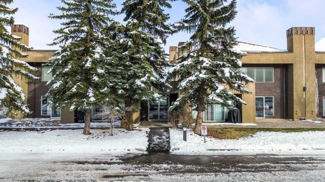 8 - 122 Village Heights Sw, Home with 2 bedrooms, 1 bathrooms and 2 parking in Calgary AB | Image 1