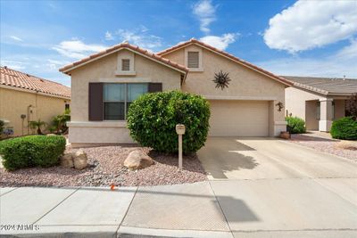 This special home in on a North/South facing lot in the guard-gated 55+ resort community of Arizona Traditions. | Image 1