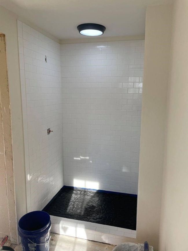 Full bathroom with a tile shower | Image 5