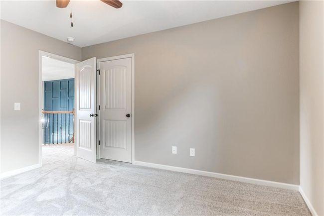 Unfurnished room with carpet flooring and a ceiling fan | Image 36
