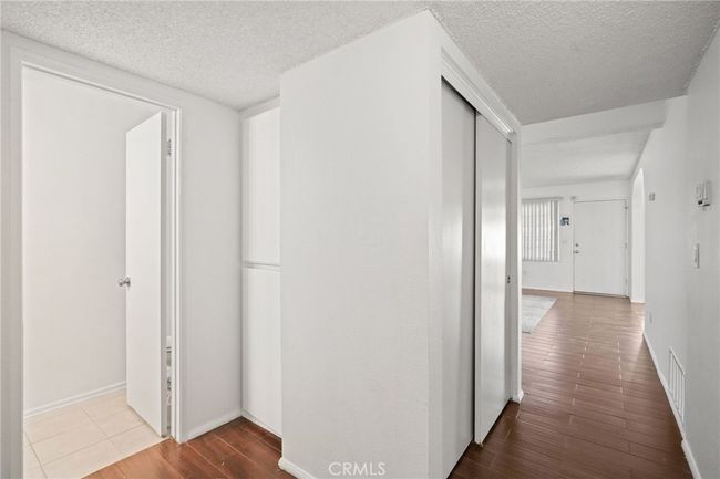 Downstairs: 1/2 bathroom to your left, 2 wall-to-wall closets & linen closet | Image 7