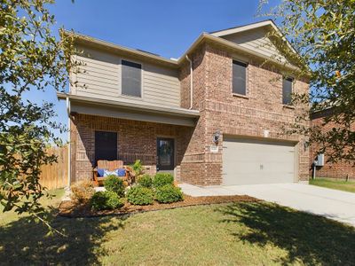 View of front of home featuring a front yard and a garage | Image 2