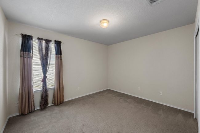 Carpeted spare room with baseboards and a textured ceiling | Image 23