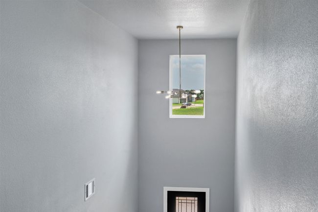 Detailed view of a chandelier and a fireplace | Image 21