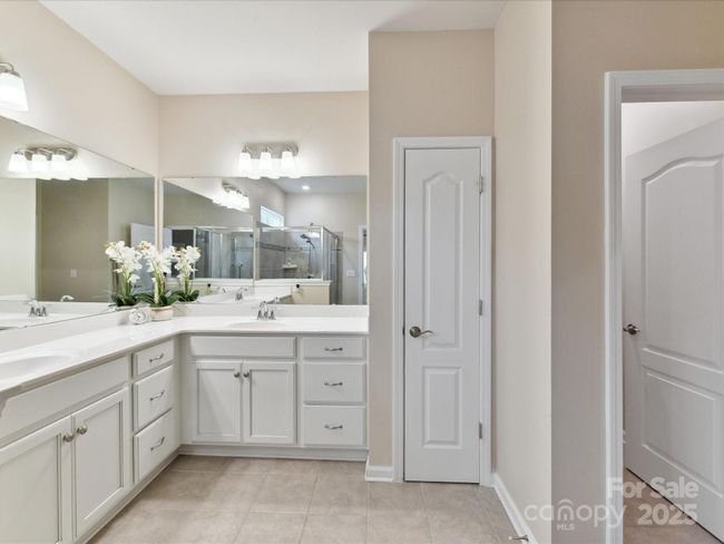 Primary Bath Large Vanity. Tiled Flooring, Walk in Closet and Linen Closet | Image 21