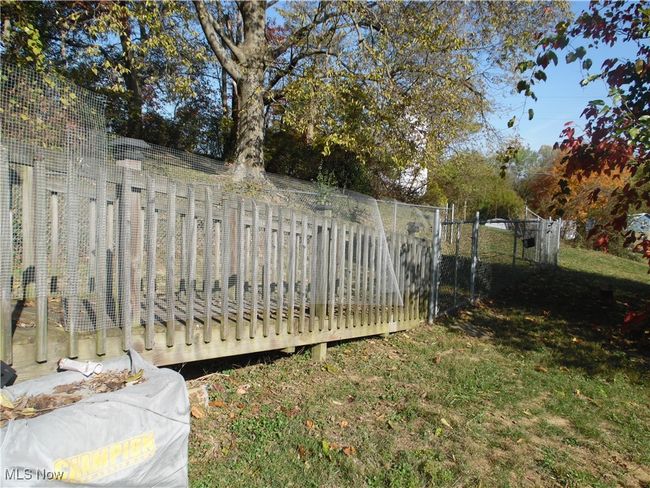 View of yard with a wooden deck | Image 4