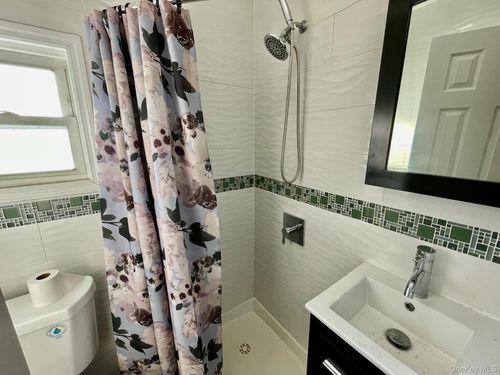 10203 Rau Ct, Howard Beach, NY, 11414-3946 | Card Image