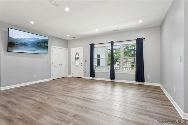 Spare room featuring recessed lighting, light wood-style floors, baseboards, and a smoke detector | Image 10