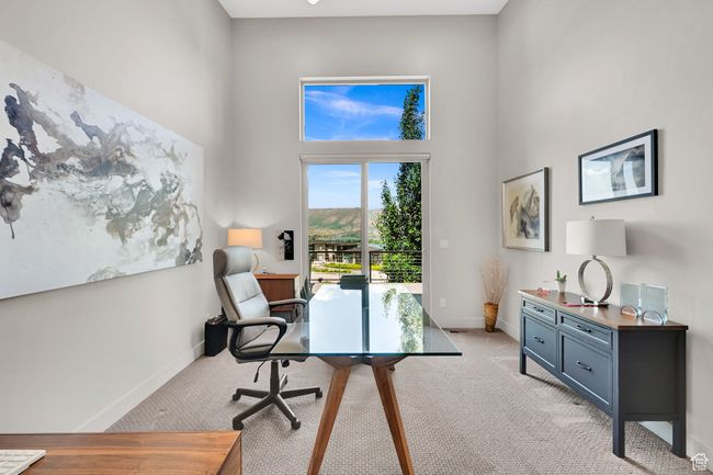 Office area with light carpet, a high ceiling, and baseboards | Image 34