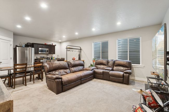 Living area with recessed lighting and light colored carpet | Image 30