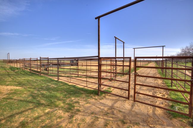 View of yard featuring an outbuilding, a rural view, and an exterior structure | Image 25